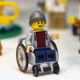 Illustration for article titled Lego's First Minifigure in a Wheelchair is Embarrassingly Overdue